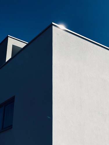 anna van burenstraat 16 low-angle photography of concrete building under blue sky 3116 cj schiedam